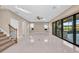 Spacious living room with sliding glass doors offers ample natural light and access to outdoor views at 8273 Shooting Star Rd, Sarasota, FL 34241