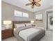 Serene main bedroom with a neutral color palette, plush bedding, and a view of the backyard at 8273 Shooting Star Rd, Sarasota, FL 34241