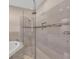 Shower featuring tile surround and seamless glass at 8273 Shooting Star Rd, Sarasota, FL 34241