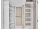 Organized walk-in closet featuring custom shelving and storage solutions at 8273 Shooting Star Rd, Sarasota, FL 34241