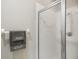 Clean bathroom featuring a glass-enclosed shower and a towel rack with decorative towels for added comfort at 8525 54Th Avenue E Cir, Bradenton, FL 34211