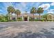 Elegant clubhouse facade with meticulous landscaping, offering a welcoming entrance and community charm at 8525 54Th Avenue E Cir, Bradenton, FL 34211