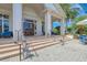 Clubhouse entrance with gray pavers, large lanterns, and double doors at 8525 54Th Avenue E Cir, Bradenton, FL 34211