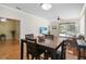 Open dining area flowing to living room with access to outdoor screened in lanai at 8525 54Th Avenue E Cir, Bradenton, FL 34211