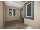 Inviting entryway with tiled floor, large windows, and decorative front door at 8525 54Th Avenue E Cir, Bradenton, FL 34211