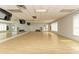 Expansive fitness studio with mirrored walls, wood floors, and ample space for group classes and individual workouts at 8525 54Th Avenue E Cir, Bradenton, FL 34211
