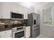 A modern kitchen featuring stainless steel appliances and sleek design at 8525 54Th Avenue E Cir, Bradenton, FL 34211