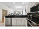 Bright kitchen with stainless steel appliances and an open design to the living space at 8525 54Th Avenue E Cir, Bradenton, FL 34211
