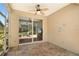 Enclosed lanai with views to both the interior living space and the screen enclosed outdoor seating area at 8525 54Th Avenue E Cir, Bradenton, FL 34211