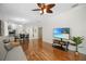 Bright open-concept living area featuring hardwood floors and seamless flow to the dining and kitchen at 8525 54Th Avenue E Cir, Bradenton, FL 34211