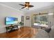 Cozy living room featuring access to the screened lanai and backyard views at 8525 54Th Avenue E Cir, Bradenton, FL 34211