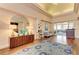 Lobby featuring a console, large rug, mirror and comfortable seating at 8525 54Th Avenue E Cir, Bradenton, FL 34211