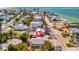 Quaint beach house with tropical landscaping and a serene street in a vibrant coastal neighborhood near the ocean at 880 N Shore Dr, Anna Maria, FL 34216
