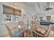 Cozy dining area is brightly lit, and the dining table is set near the bright windows at 880 N Shore Dr, Anna Maria, FL 34216