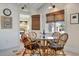 This dining area has a cozy table, chairs, and is near the entry to the home's bedroom at 880 N Shore Dr, Anna Maria, FL 34216