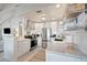 Modern kitchen featuring stainless steel appliances, white cabinets, subway tile backsplash and ample counter space at 880 N Shore Dr, Anna Maria, FL 34216