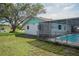 Spacious backyard with a pool area, ideal for relaxation and recreation at 1004 65Th W Ave, Bradenton, FL 34207
