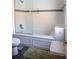 A bathroom features a shower-tub combination with decorative tiling at 1004 65Th W Ave, Bradenton, FL 34207
