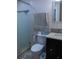A bathroom features a sink, toilet, shower with glass doors, and a towel rack at 1004 65Th W Ave, Bradenton, FL 34207