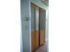 A beautiful wood folding closet door with frosted glass panels creates an attractive design element at 1004 65Th W Ave, Bradenton, FL 34207