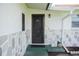 Home's front entrance with a welcoming door and stone accents at 1004 65Th W Ave, Bradenton, FL 34207