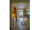 The kitchen features oak cabinets, breakfast bar and a pass through to another room at 1004 65Th W Ave, Bradenton, FL 34207