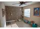 A uniquely designed exposed brick wall provides character to this living room at 1004 65Th W Ave, Bradenton, FL 34207