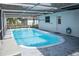 Inviting screened-in pool with sparkling blue water at 1004 65Th W Ave, Bradenton, FL 34207