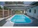 Inviting screened-in pool with sparkling blue water, perfect for relaxation and fun at 1004 65Th W Ave, Bradenton, FL 34207
