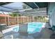 Enclosed pool area with seating, offering a private outdoor retreat at 1004 65Th W Ave, Bradenton, FL 34207