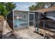 Backyard pool with a screened enclosure, perfect for outdoor entertaining at 1004 65Th W Ave, Bradenton, FL 34207