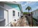 Side exterior showing the home's clean design and well-maintained fence at 1004 65Th W Ave, Bradenton, FL 34207