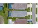 Close aerial view of three homes, showcasing private pools, landscaping and roof details at 10120 Canaveral Cir, Sarasota, FL 34241