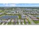 Expansive aerial view of a Primary-planned community with lakes, green spaces, and well-maintained homes at 10120 Canaveral Cir, Sarasota, FL 34241
