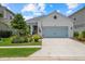 Inviting single-story home featuring a neat front yard, two-car garage, and an attractive facade in a lovely community at 10120 Canaveral Cir, Sarasota, FL 34241