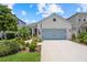 Charming single-story home with a two-car garage, well-manicured landscaping, and a walkway leading to the front door at 10120 Canaveral Cir, Sarasota, FL 34241