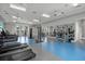 Spacious gym with treadmills, weight machines, mirrored walls, and ceiling fans at 10120 Canaveral Cir, Sarasota, FL 34241