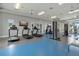 Well-equipped gym featuring treadmills, weights, and mounted televisions for entertainment at 10120 Canaveral Cir, Sarasota, FL 34241