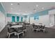 Bright recreation room featuring table seating, a pool table and large windows at 10120 Canaveral Cir, Sarasota, FL 34241
