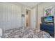 Cozy bedroom with a tropical theme, closet and TV at 10186 Crystal Isle Cir, Sarasota, FL 34241
