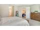 Bright bedroom featuring a neutral color palette and view to living room and kitchen at 10186 Crystal Isle Cir, Sarasota, FL 34241