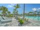 Resort-style pool with inviting lounge chairs, providing a perfect oasis for relaxation and recreation at 10186 Crystal Isle Cir, Sarasota, FL 34241