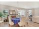 Dining room with blue tablecloth, wood floors, and stylish chandelier at 10186 Crystal Isle Cir, Sarasota, FL 34241