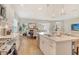 Bright, open-concept kitchen features a center island with stainless steel appliances at 10186 Crystal Isle Cir, Sarasota, FL 34241