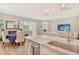 Modern kitchen island with quartz countertop, stainless sink, and pendant lighting at 10186 Crystal Isle Cir, Sarasota, FL 34241