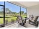 Inviting screened lanai furnished with cozy seating, creating an ideal outdoor living space at 10186 Crystal Isle Cir, Sarasota, FL 34241