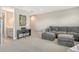 Spacious living room with plush seating, and carpet flooring. There is even room for a piano at 10186 Crystal Isle Cir, Sarasota, FL 34241