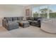 Oversized living room featuring comfortable seating, a large window, and lots of space at 10186 Crystal Isle Cir, Sarasota, FL 34241