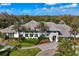 Expansive property featuring meticulously manicured lawns and tropical landscaping at 11435 Fort Lauderdale Pl, Venice, FL 34293