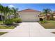 Well-manicured home with concrete driveway and two-car garage provides ample parking at 11435 Fort Lauderdale Pl, Venice, FL 34293